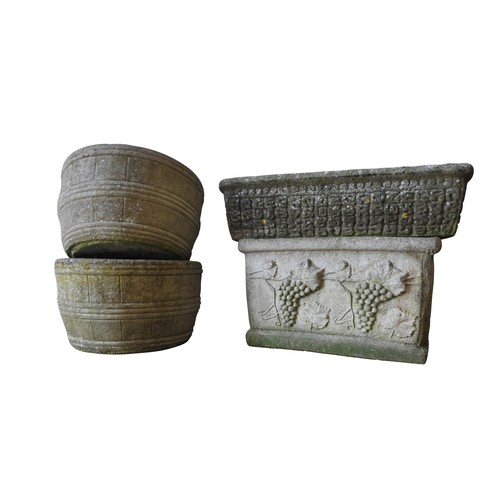 141 - A PAIR OF RECONSTITUTED STONE BARREL STYLE GARDEN TUBS AND TWO TROUGHS, the deeper trough decorated ... 