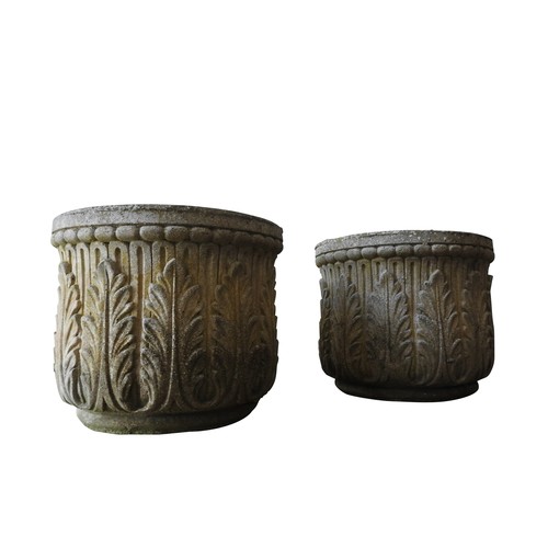 142 - A PAIR OF WEATHERED RECONSTITUTED STONE GARDEN PLANTERS, with repeating foliate pattern, 39 cm high ... 