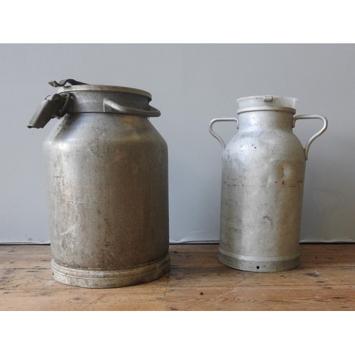 144 - TWO VINTAGE FRENCH GALVANIZED DAIRY CHURNS, the largest measuring 52 cm high and 35 cm diameter