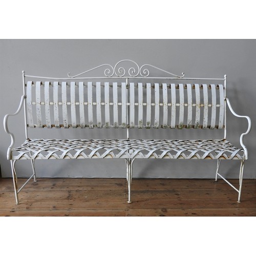 148 - A FRENCH CREAM PAINTED WROUGHT-IRON GARDEN BENCH SEAT AND TWO MATCHING ARMCHAIRS, all with lattice w... 