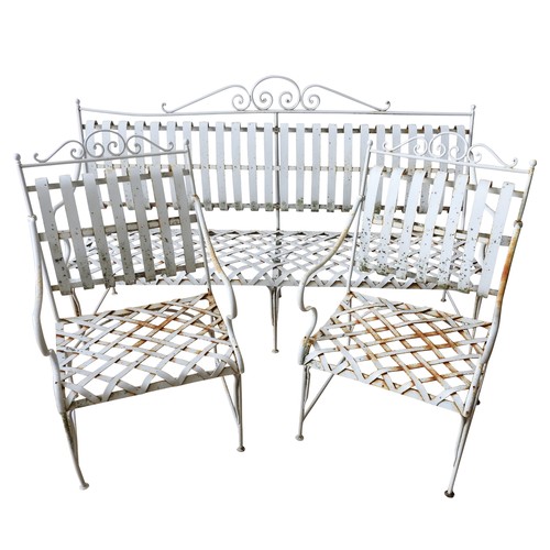 148 - A FRENCH CREAM PAINTED WROUGHT-IRON GARDEN BENCH SEAT AND TWO MATCHING ARMCHAIRS, all with lattice w... 