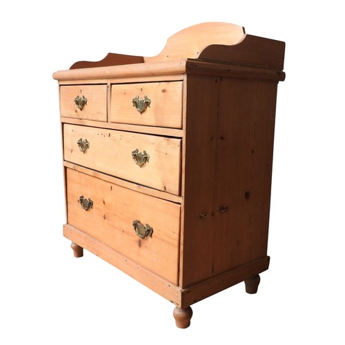 62 - A VICTORIAN PINE GALLERY BACK CHEST OF FOUR DRAWERS, two short drawers over two long drawers, on tur... 