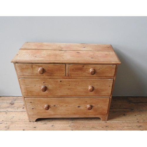 64 - A 19TH CENTURY WAXED PINE CHEST OF FOUR DRAWERS, comprised of two short drawers over two long drawer... 