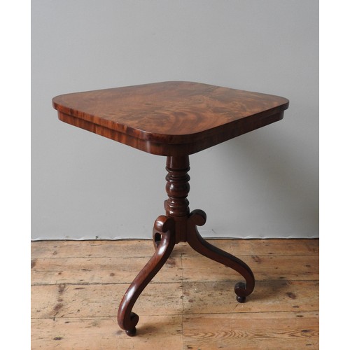 65 - A VICTORIAN MAHOGANY WINE TABLE, the tilting oblong top on a turned pillar, supported by three swept... 