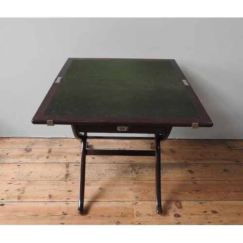 69 - A FOLDING CAMPAIGN-STYLE CARD TABLE, with baize lined top and frieze drawer, and London label