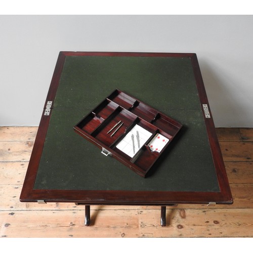 69 - A FOLDING CAMPAIGN-STYLE CARD TABLE, with baize lined top and frieze drawer, and London label