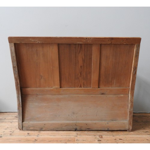 72 - A 19TH CENTURY PINE SETTLE, with three panel back, lift-top seat and open rail arms, 106 x 132 x 45 ... 