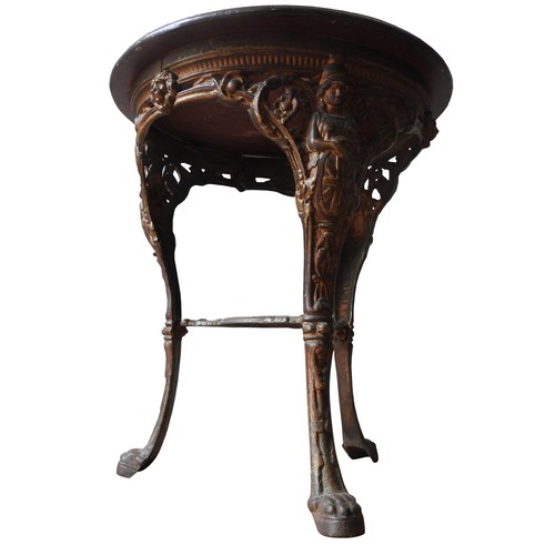 74 - A VINTAGE CAST-IRON PUB TABLE WITH CIRCULAR TOP, with Brittania decoration to the top of the legs, t... 