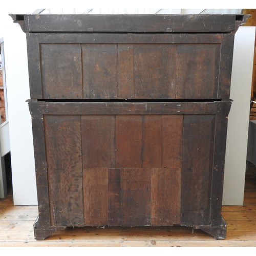 76 - A 18TH CENTURY AUSTRIAN WALNUT SHRANK,  in two sections, with parquetry door panels, long frieze dra... 