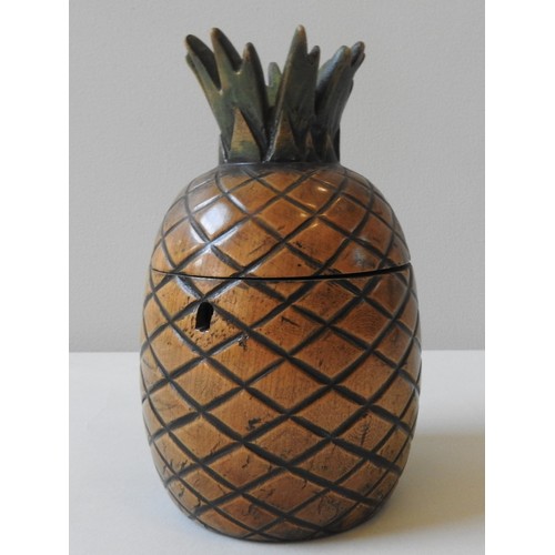 304 - A 20TH CENTURY TREEN TEA CADDY, in the form of a pineapple, 20 cm high