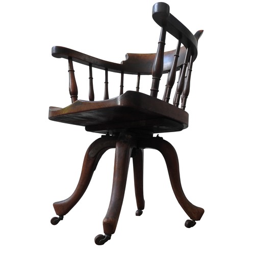 78 - A 19TH CENTURY MAHOGANY REVOLVING DESK CHAIR, the bow back top rail supported by turned pillars, on ... 