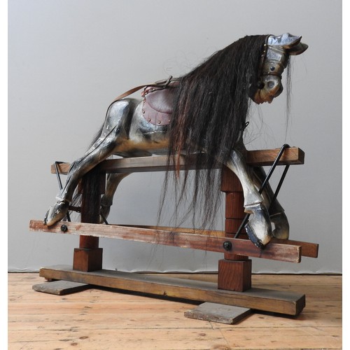 316 - A VINTAGE PAINTED PINE NURSERY ROCKING HORSE, with a dappled grey finish, on a trestle base, 110 x 1... 