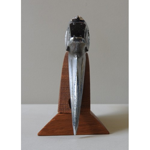 326 - A PEUGEOT 203 HOOD ORNAMENT, circa 1950, on a custom made plinth, 14 cm high, 27 cm long