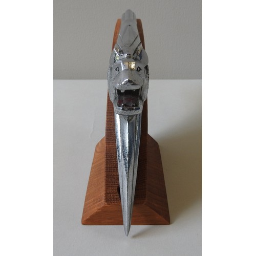 326 - A PEUGEOT 203 HOOD ORNAMENT, circa 1950, on a custom made plinth, 14 cm high, 27 cm long