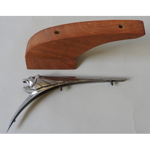 326 - A PEUGEOT 203 HOOD ORNAMENT, circa 1950, on a custom made plinth, 14 cm high, 27 cm long