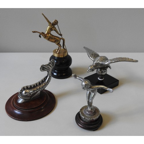 329 - FOUR ASSORTED REPLICA HOOD ORNAMENTS, depicting fish, centaur, eagle and nude, all mounted on wooden... 