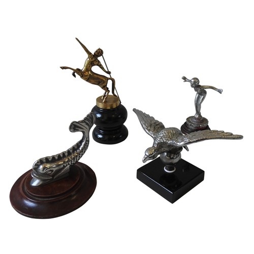 329 - FOUR ASSORTED REPLICA HOOD ORNAMENTS, depicting fish, centaur, eagle and nude, all mounted on wooden... 