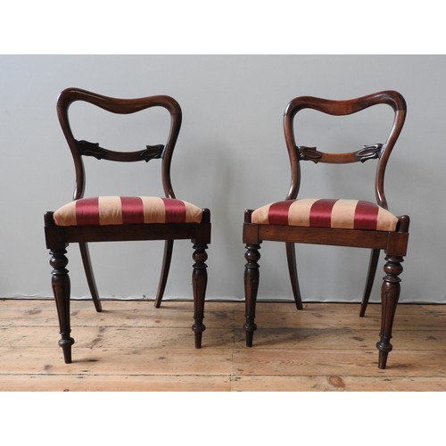 87 - A SET OF SIX MAHOGANY YOKE BACK DINING CHAIRS, and two very near matching yoke back chairs, all upho... 