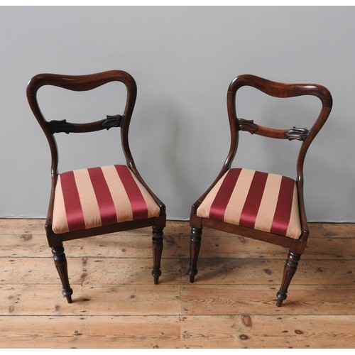 87 - A SET OF SIX MAHOGANY YOKE BACK DINING CHAIRS, and two very near matching yoke back chairs, all upho... 