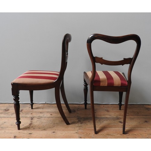 87 - A SET OF SIX MAHOGANY YOKE BACK DINING CHAIRS, and two very near matching yoke back chairs, all upho... 