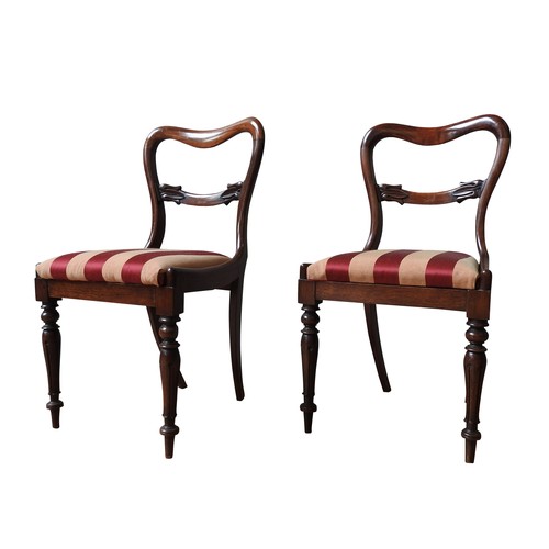 87 - A SET OF SIX MAHOGANY YOKE BACK DINING CHAIRS, and two very near matching yoke back chairs, all upho... 