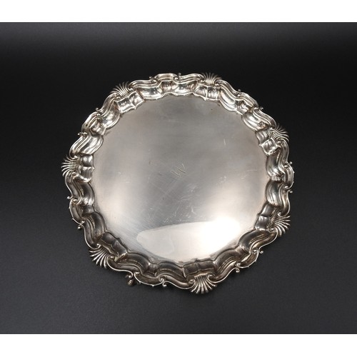 465 - A SILVER SALVER, with Acanthus shell-scroll border, on three claw feet, London 1889, maker's stamp R... 