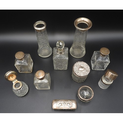 470 - ELEVEN ASSORTED SILVER MOUNTED GLASS SCENT BOTTLES, VASES AND INK WELLS, the tallest vase standing 1... 