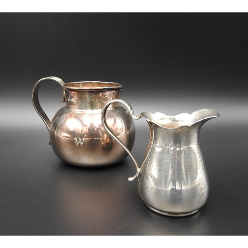 471 - A SILVER MILK JUG AND SILVER CREAM JUG, the larger milk jug of compressed globular form with reeded ... 