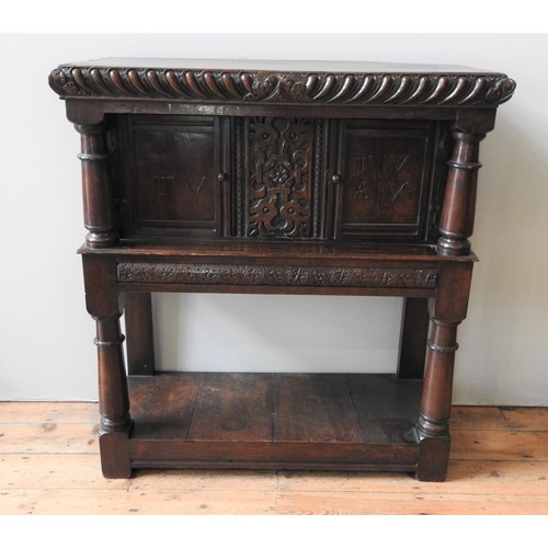 101 - A 17TH CENTURY OAK AND WALNUT LIVERY CUPBOARD, circa 1620, 123 x 113 x 49 cm