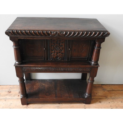 101 - A 17TH CENTURY OAK AND WALNUT LIVERY CUPBOARD, circa 1620, 123 x 113 x 49 cm