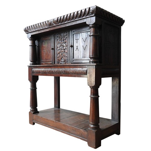 101 - A 17TH CENTURY OAK AND WALNUT LIVERY CUPBOARD, circa 1620, 123 x 113 x 49 cm