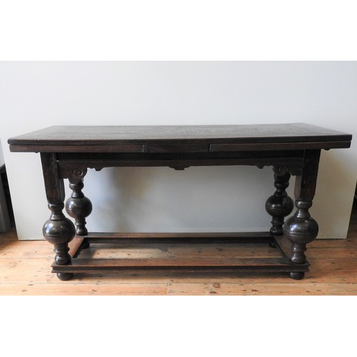 102 - AN EARLY 17TH CENTURY DUTCH OAK DRAW-LEAF TABLE, circa 1630 and later, 81 x 163 x 75 cm