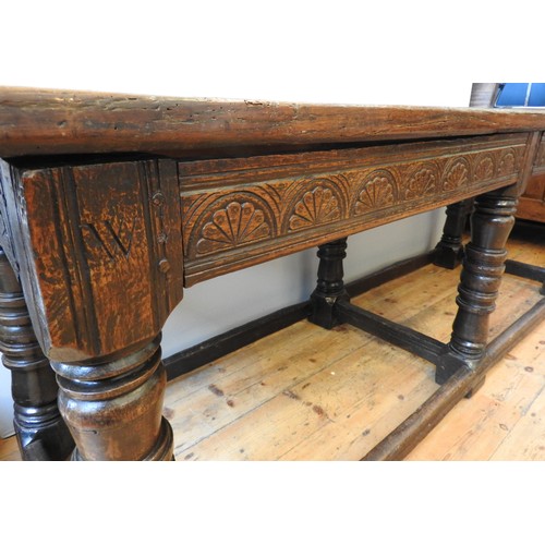 112 - A SUPERB CARVED OAK SIX LEG TABLE, with rare form baluster turned legs, with the initials WD carved ... 