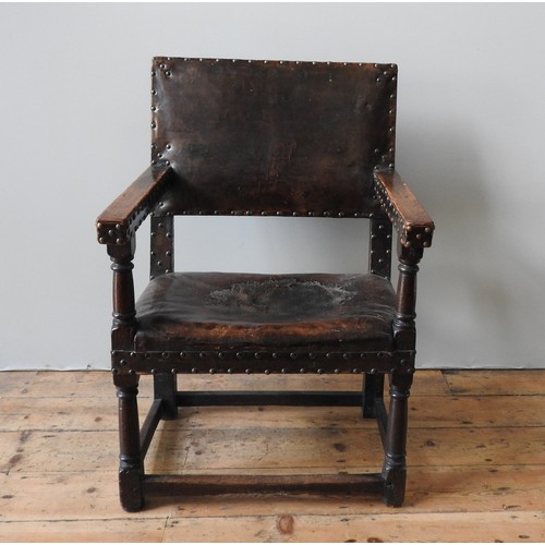 116 - A LARGE CHARLES I LEATHER COVERED OAK ARMCHAIR