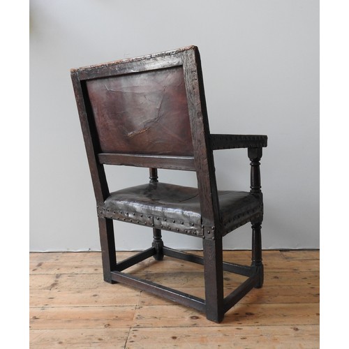 116 - A LARGE CHARLES I LEATHER COVERED OAK ARMCHAIR