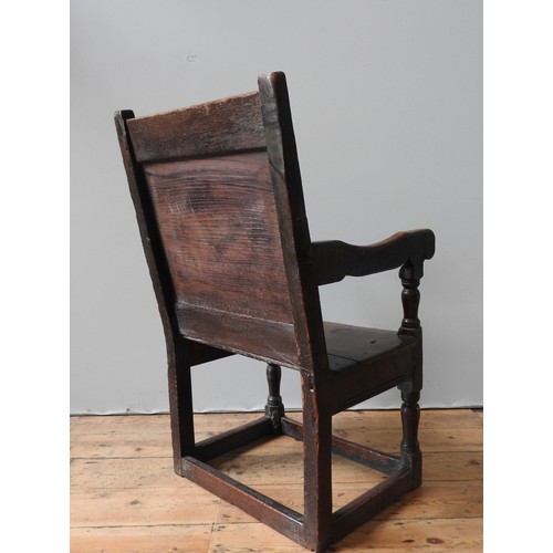 120 - A CHARLES II OAK ARMCHAIR