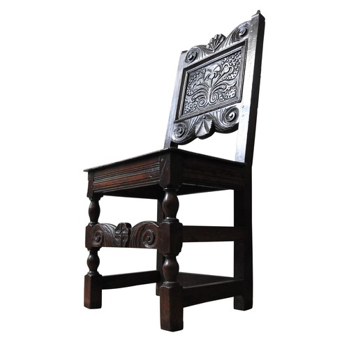 122 - A CHARLES II CARVED OAK CHAIR