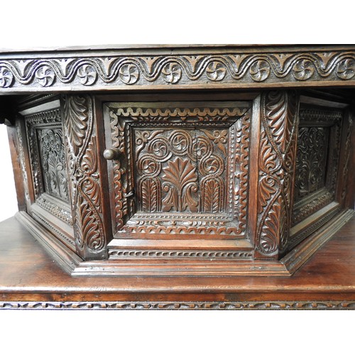 125 - AN EARLY 17TH CENTURY JOINED OAK AND CARVED LIVERY CUPBOARD, originating from Yorkshire, 157 x 145 x... 