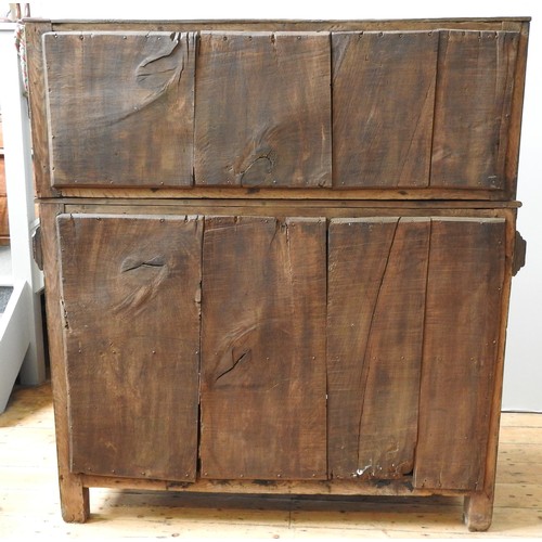 125 - AN EARLY 17TH CENTURY JOINED OAK AND CARVED LIVERY CUPBOARD, originating from Yorkshire, 157 x 145 x... 