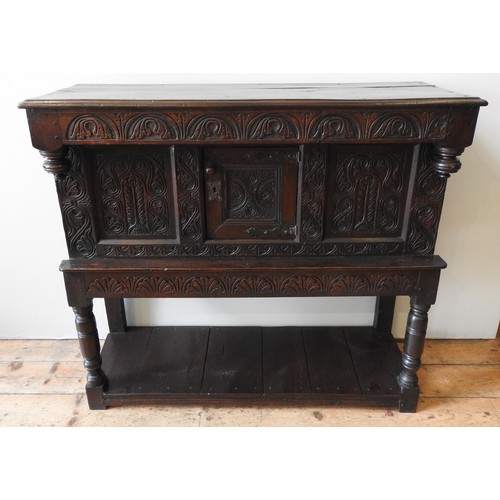 128 - A SMALL CHARLES II CARVED OAK LIVERY CUPBOARD, Yorkshire, 113 x 122 x 45 cm