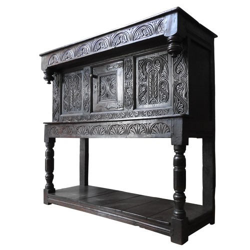 128 - A SMALL CHARLES II CARVED OAK LIVERY CUPBOARD, Yorkshire, 113 x 122 x 45 cm