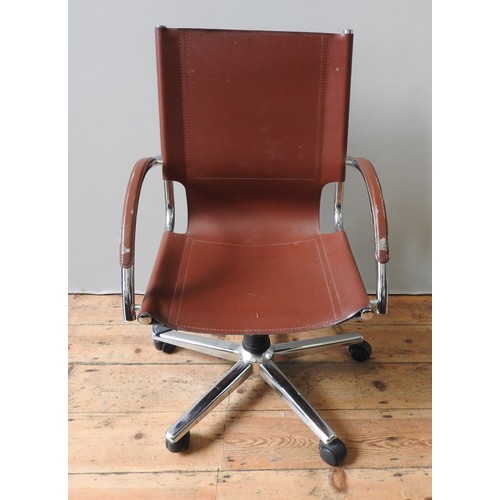 131 - A LEATHER SWIVEL CHAIR, with down swept arms