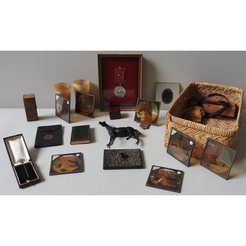 290 - A FRAMED EQUESTRIAN 'SHOW' MEDAL, a WWI Red Cross Medal, two horn beakers, a patent door wedge and v... 