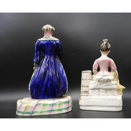 424 - A VICTORIAN STAFFORDHIRE FIGURE OF A 'TURK', her dress intricately decorated in gilt sprigs, her rob... 