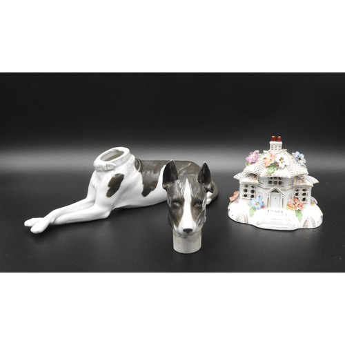 437 - A CONTINENTAL PORCELAIN 'BOX' IN THE FORM OF A RECUMBENT DOG WITH A REMOVABLE HEAD (toe chipped) and... 