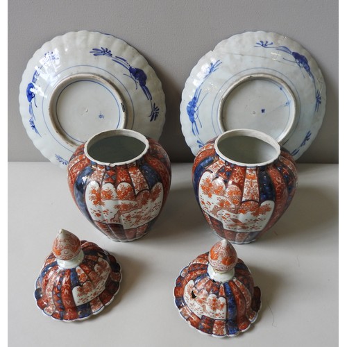 440 - A PAIR OF 19TH CENTURY IMARI COVERED VASES AND TWO DISHES, the lobed baluster vases with lids, 32 cm... 