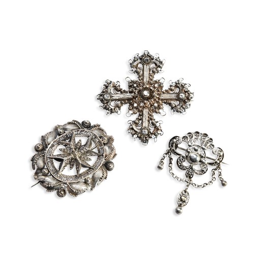 548 - THREE FILIGREE DESIGN SILVER BROOCHESOne finely worked filigree cross with brooch pin fitting.Togeth... 