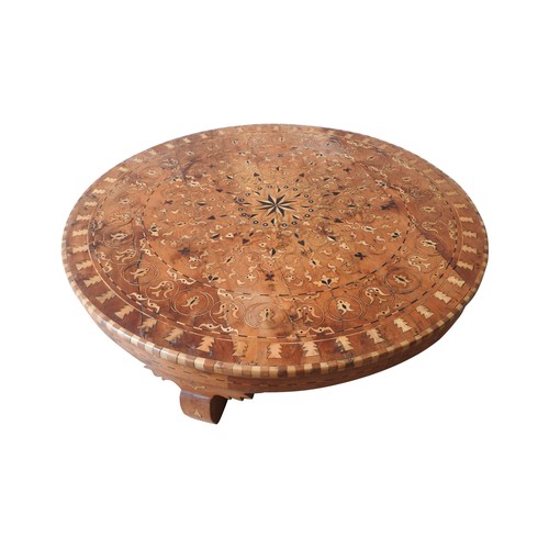 132 - A LOW CIRCULAR INLAID BAJOT TABLE, profusely decorated with a foliate motif