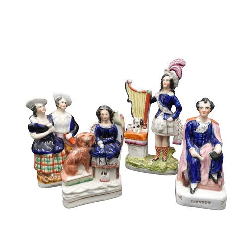 423 - A 19TH CENTURY STAFFORDSHIRE FIGURE OF A SCOTTISH DANCER WITH A HARP AND SPANIEL,  a seated figure o... 