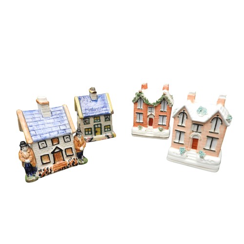 435 - A VICTORIAN PEARLWARE STAFFORDSHIRE MONEY BOX IN THE FORM OF A COTTAGE FLANKED BY TWO FIGURES and th... 